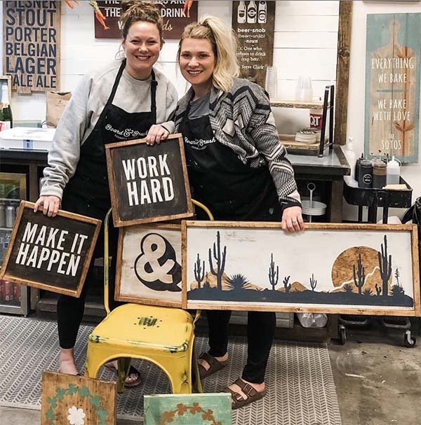 friends Friends proudly showing their wood signs