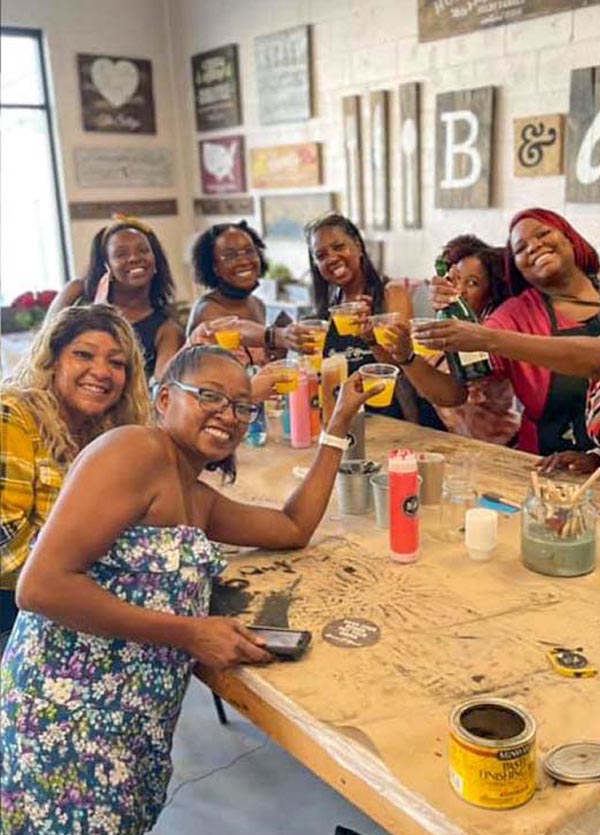 Ladies sip at paint party workshop